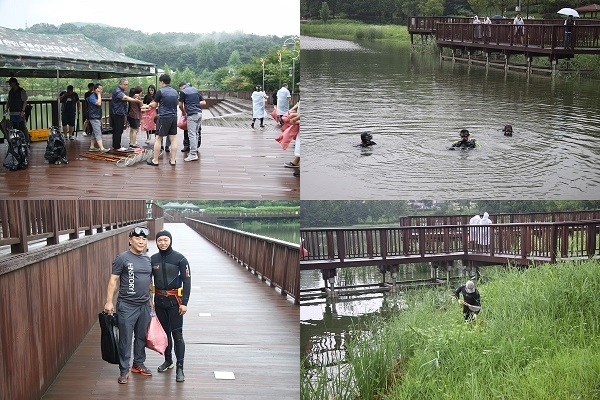 ▲특수임무유공자회 회원들이 잠수복등 특수 장비를 착용하고 수중 부유물과 호수 바닥에 버려져 있는 쓰레기를 수거하고 일반 자원봉사자들은 호수 주변을 돌며 쓰레기를 수거 하는 등 수변 정화활동을 펼쳤다.(사진=최병양 기자)